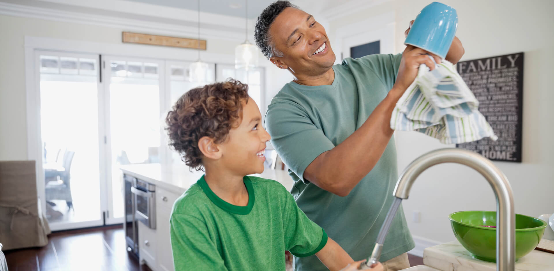 father and son washing dishes sized