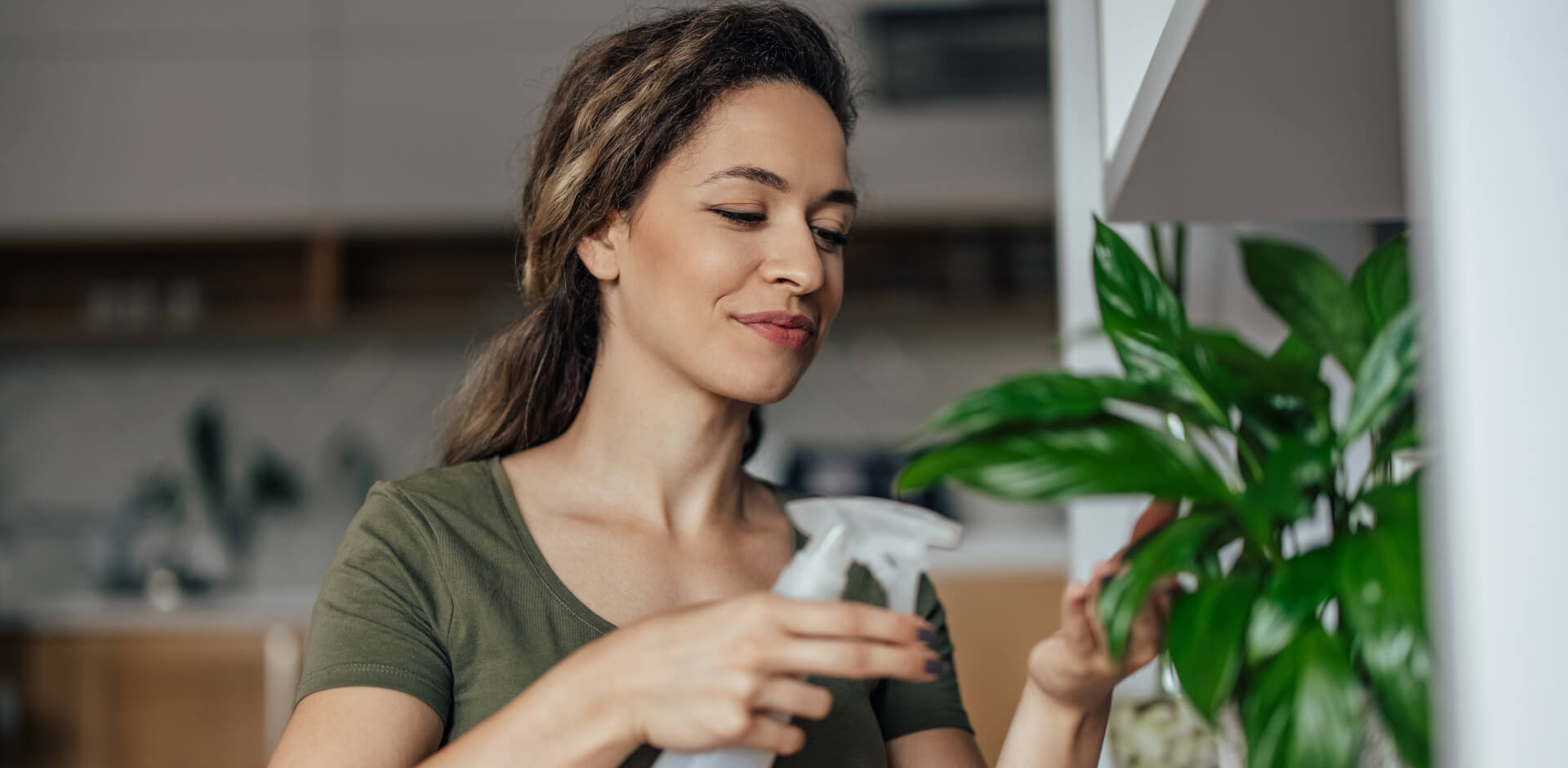 woman watering plants sized